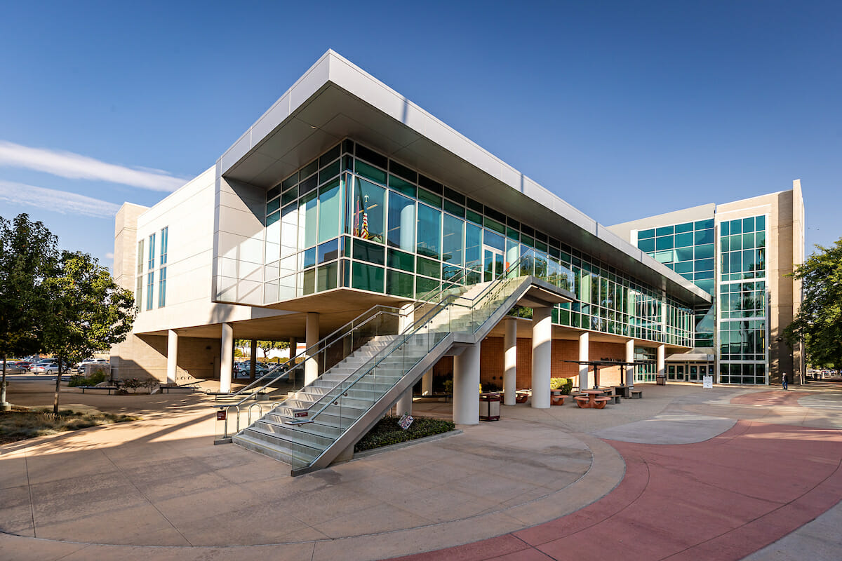 Modern WesternU COMP Health Sciences building in Pomona, CA, reflecting the innovative spirit of osteopathic education under the clear California sky.