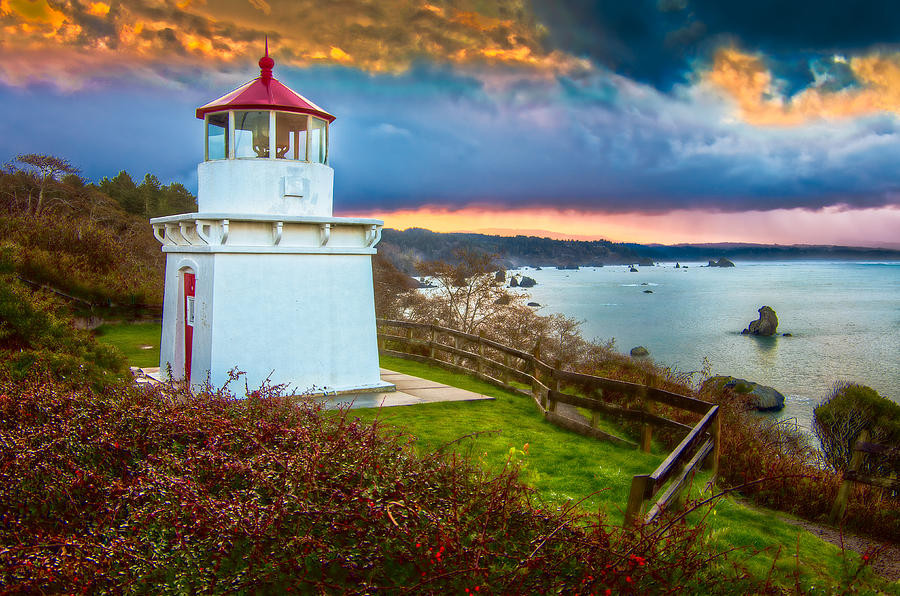 The iconic Trinidad, CA lighthouse perched above the rugged coastline, overlooking the Pacific Ocean