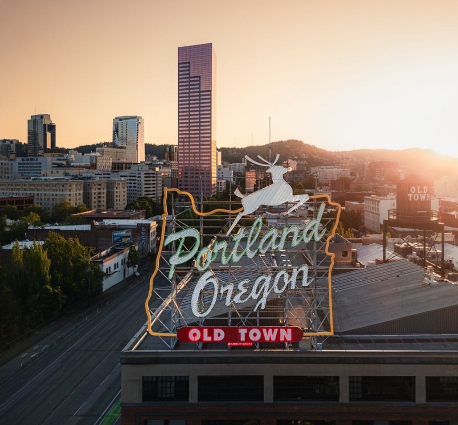 Portland downtown featuring the iconic Old Town sign at sunset, showcasing the vibrant city atmosphere.