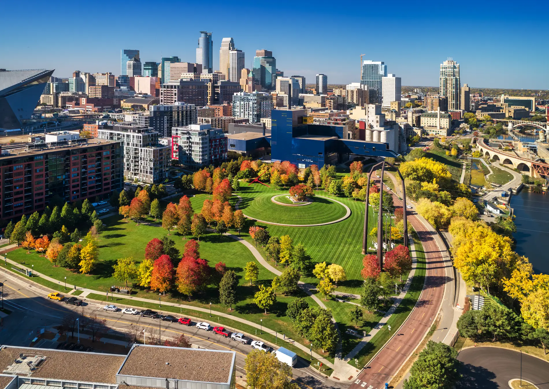 Aerial view of downtown Minneapolis and Gold Medal Park in autumn, home of the Dr. Gerald Timm Endowed Professor opportunity in the UMN Department of Urology