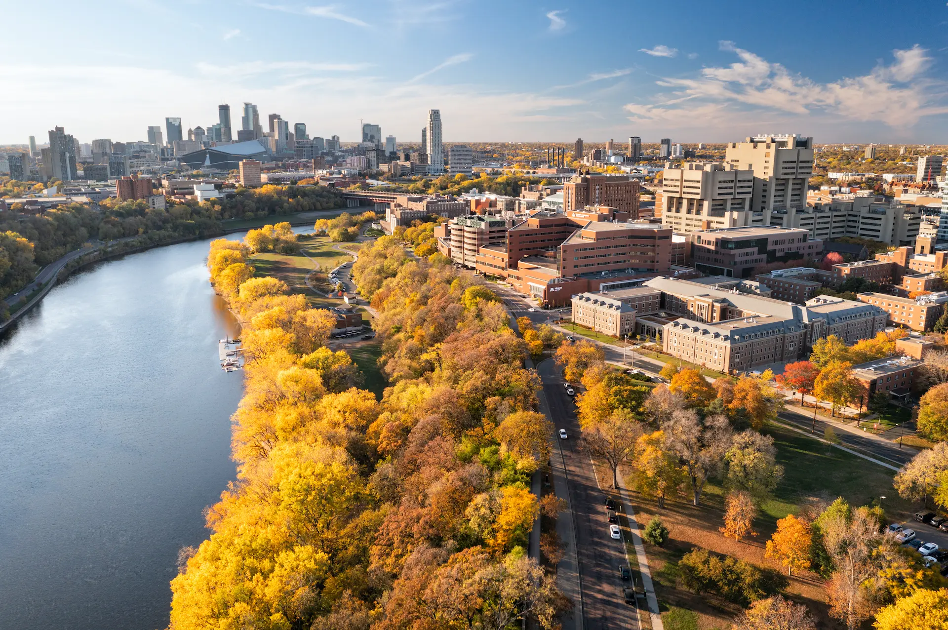 Aerial view of the University of Minnesota campus and medical center along the Mississippi River, home of the Center for Geroscience and Healthy Aging in Minneapolis