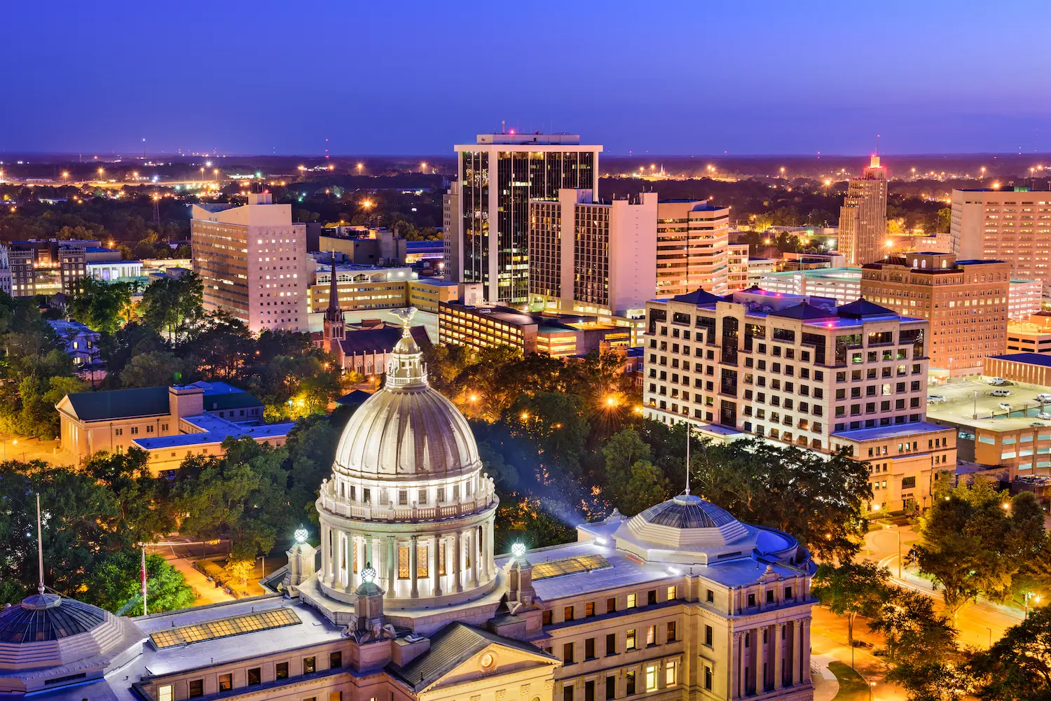 Downtown Jackson, Mississippi skyline at dusk with the State Capitol dome, home of the University of Mississippi Medical Center and its academic rheumatology faculty position